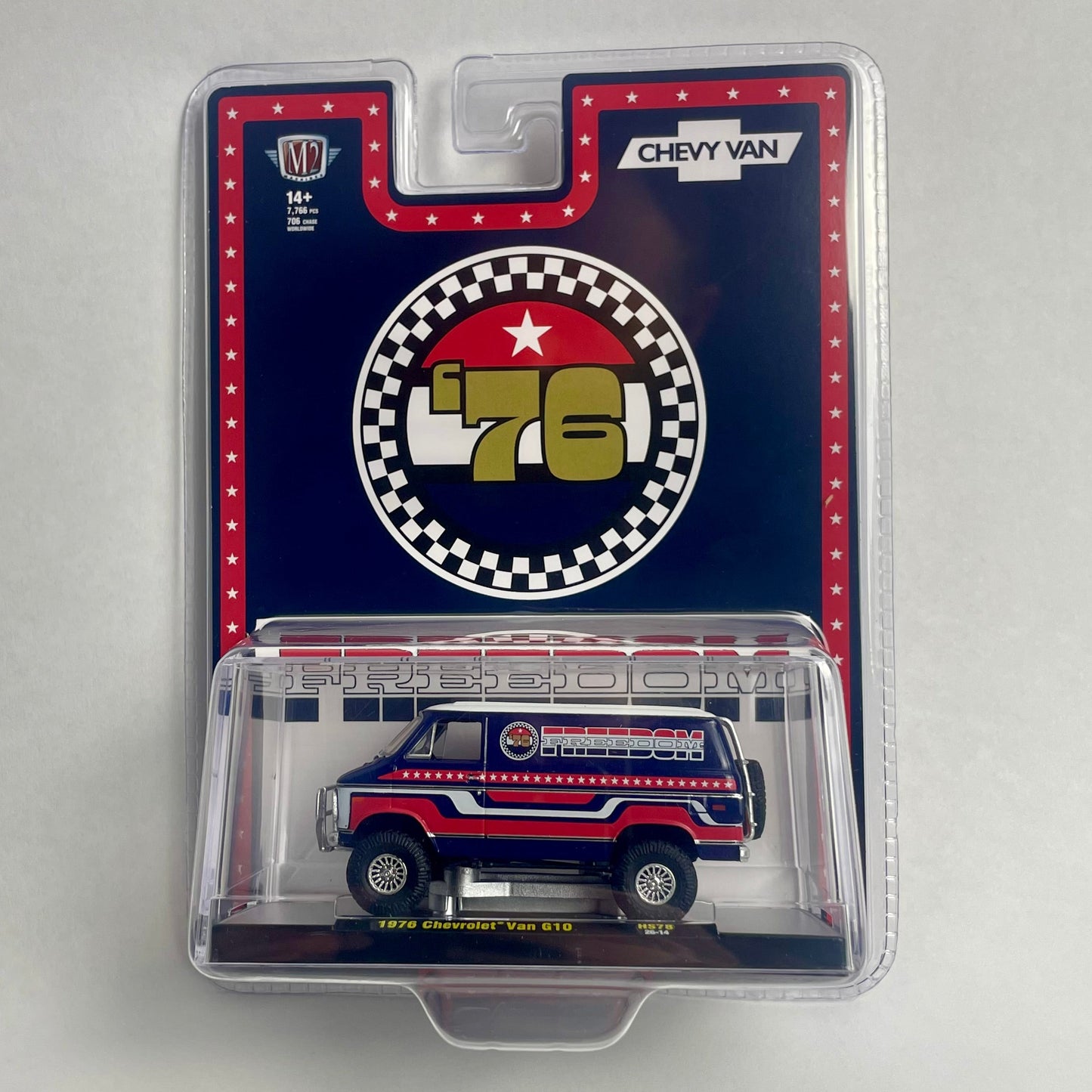 A packaged die-cast model car of a 1976 Chevy Van, shown in its original blister pack against a neutral light gray background.